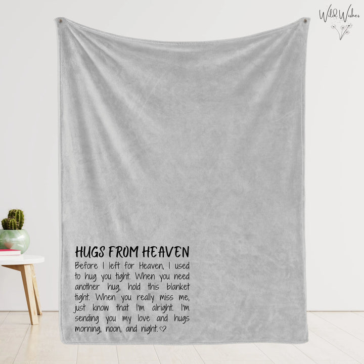 Soft gray 'Hugs from Heaven' memorial blanket hanging to highlight the poem in the left corner.